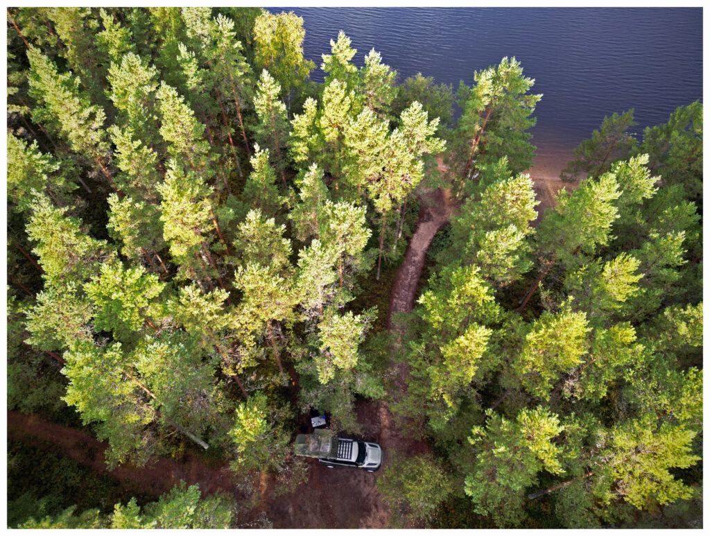 Land Rover Defender camping in the woods in Sweden